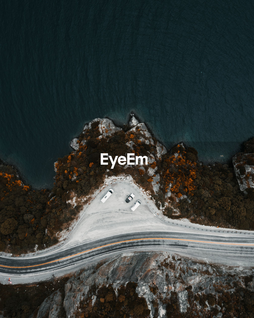 High angle view of road by sea against mountain