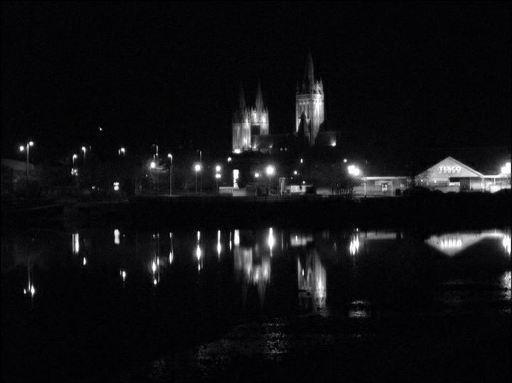 VIEW OF ILLUMINATED BUILDINGS AT NIGHT