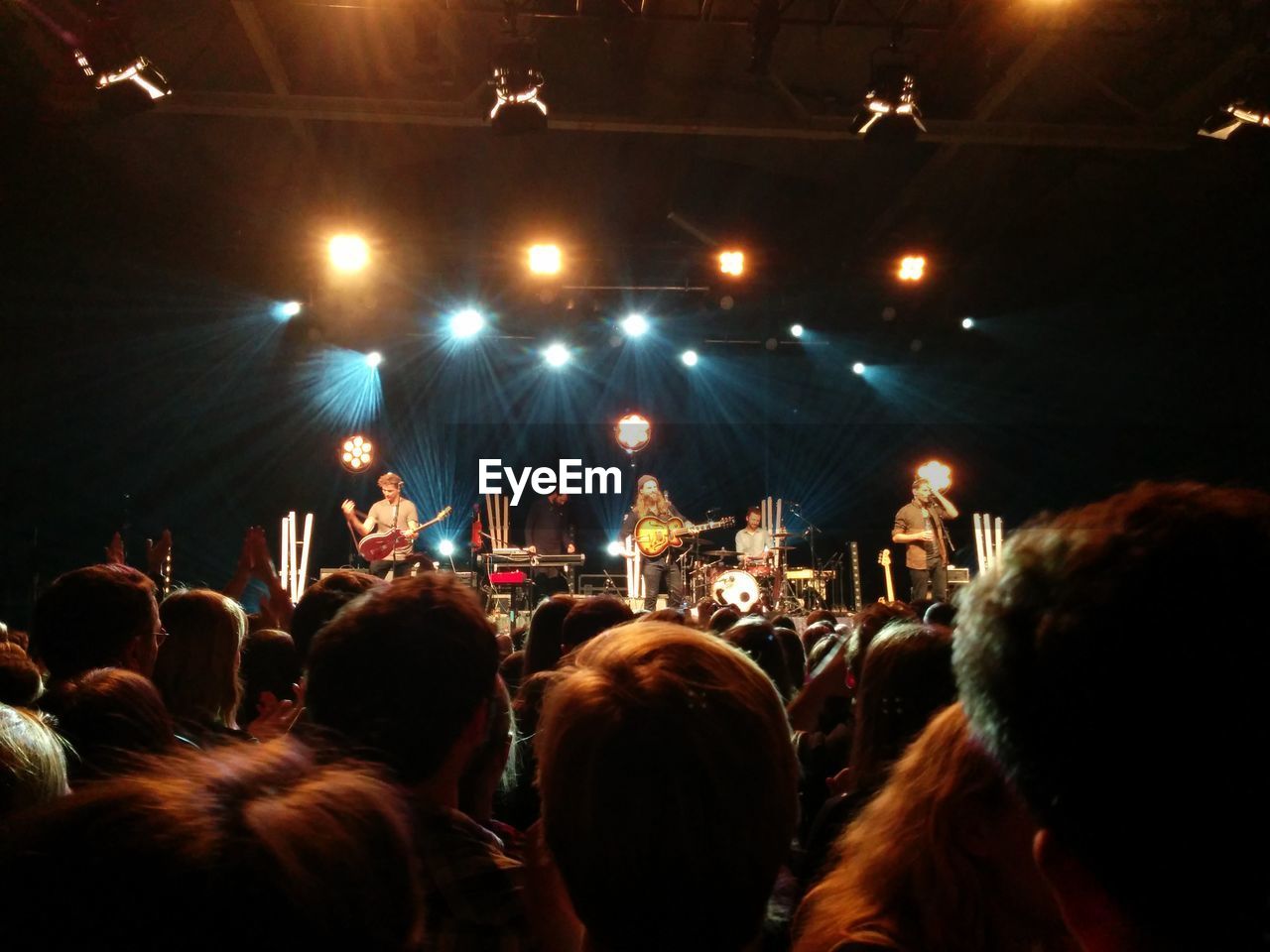 PEOPLE ENJOYING CONCERT AT NIGHT