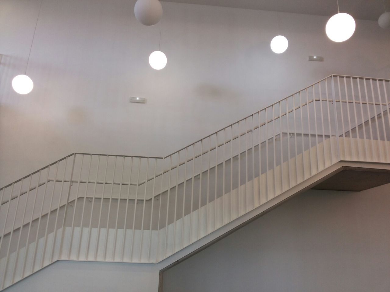 Low angle view of staircase against wall