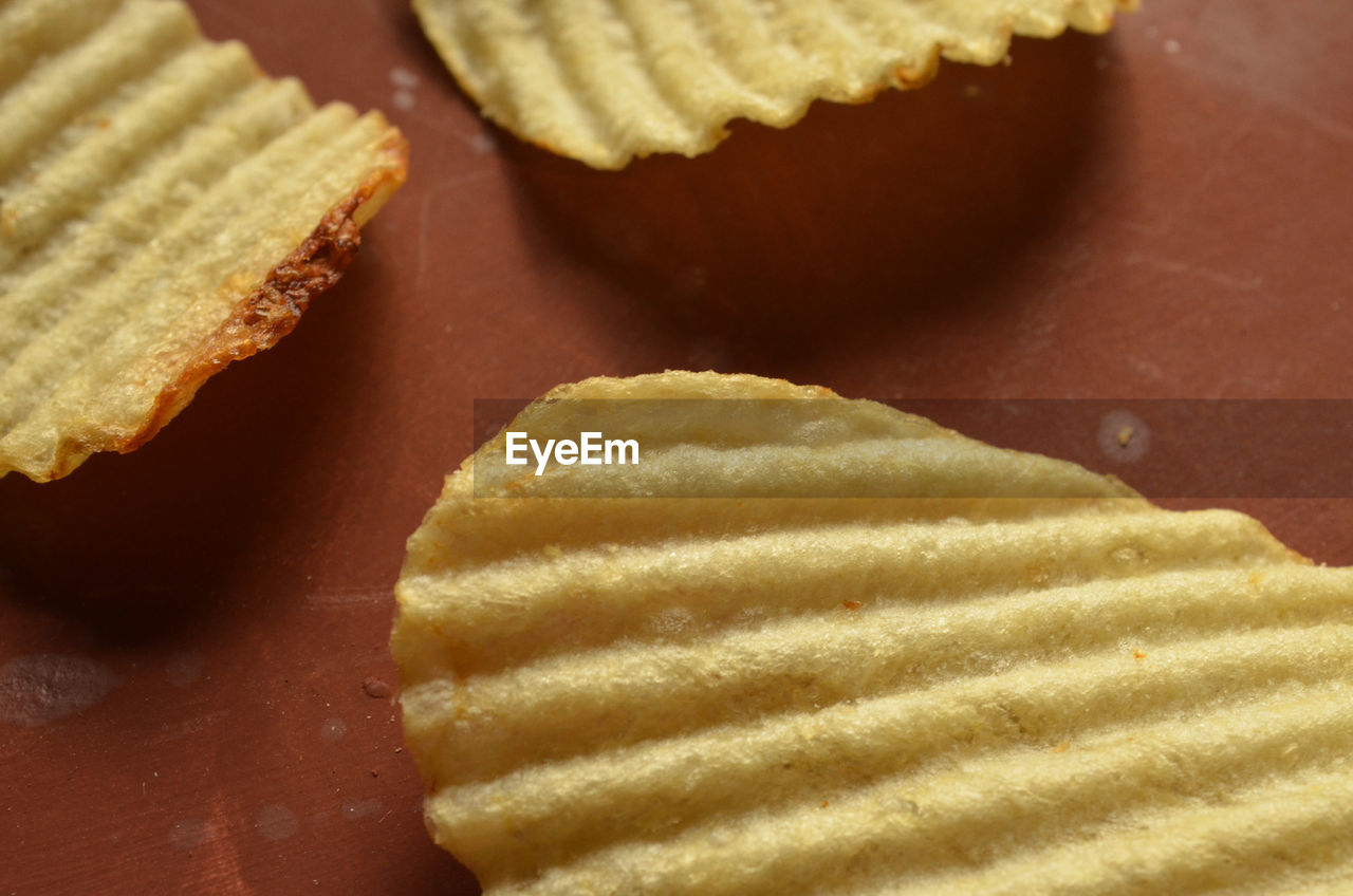 Close-up of potato chips on table