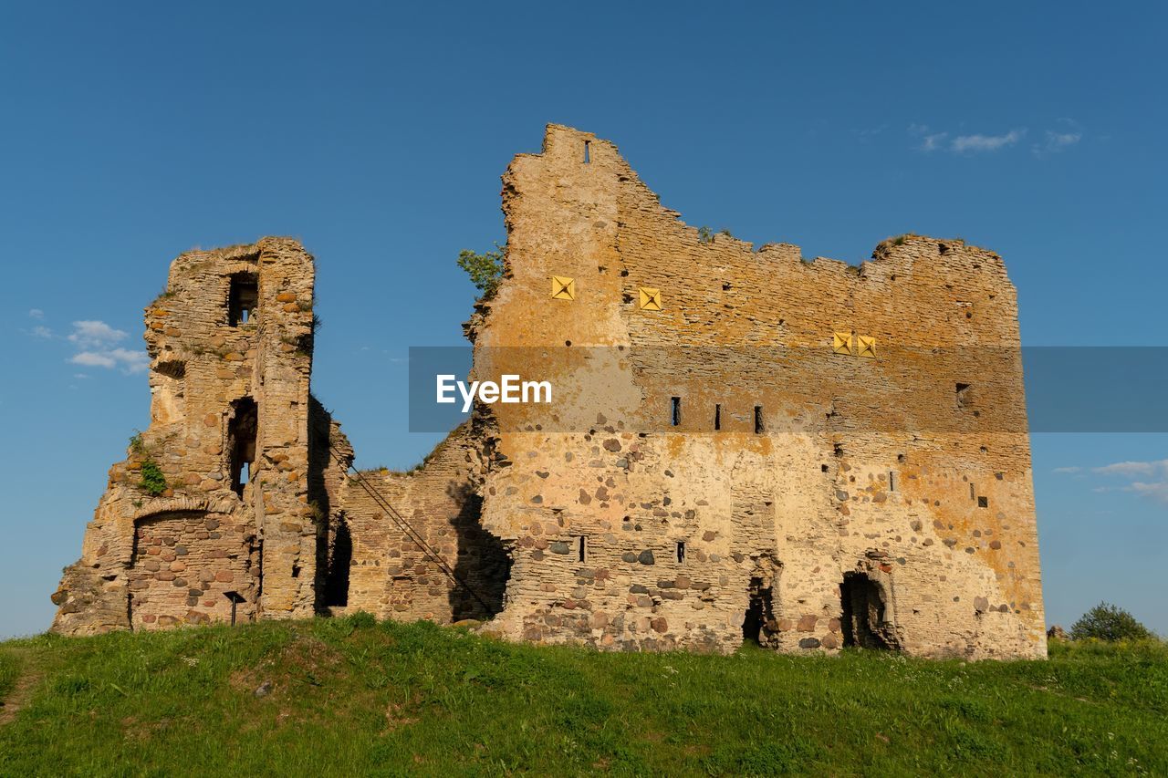 Low angle view of old castle against clear sky