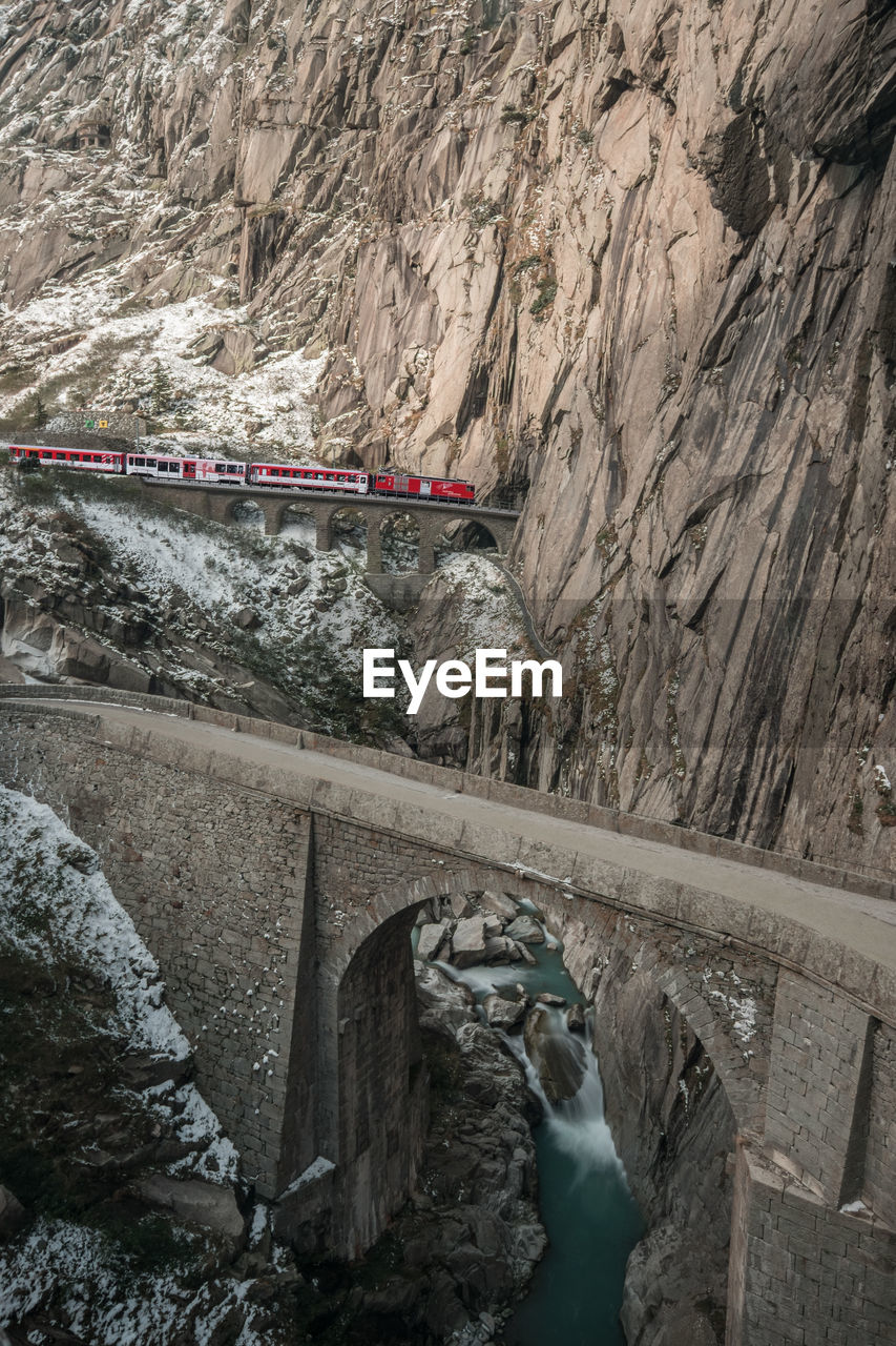 Train is crossing spectacular devils canyon near andermatt switzerland.