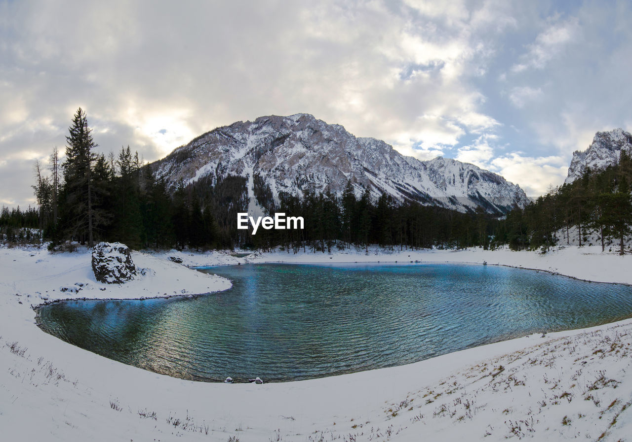 Panoramic view of green lake in sunny winter day famous tourist destination in styria region austria