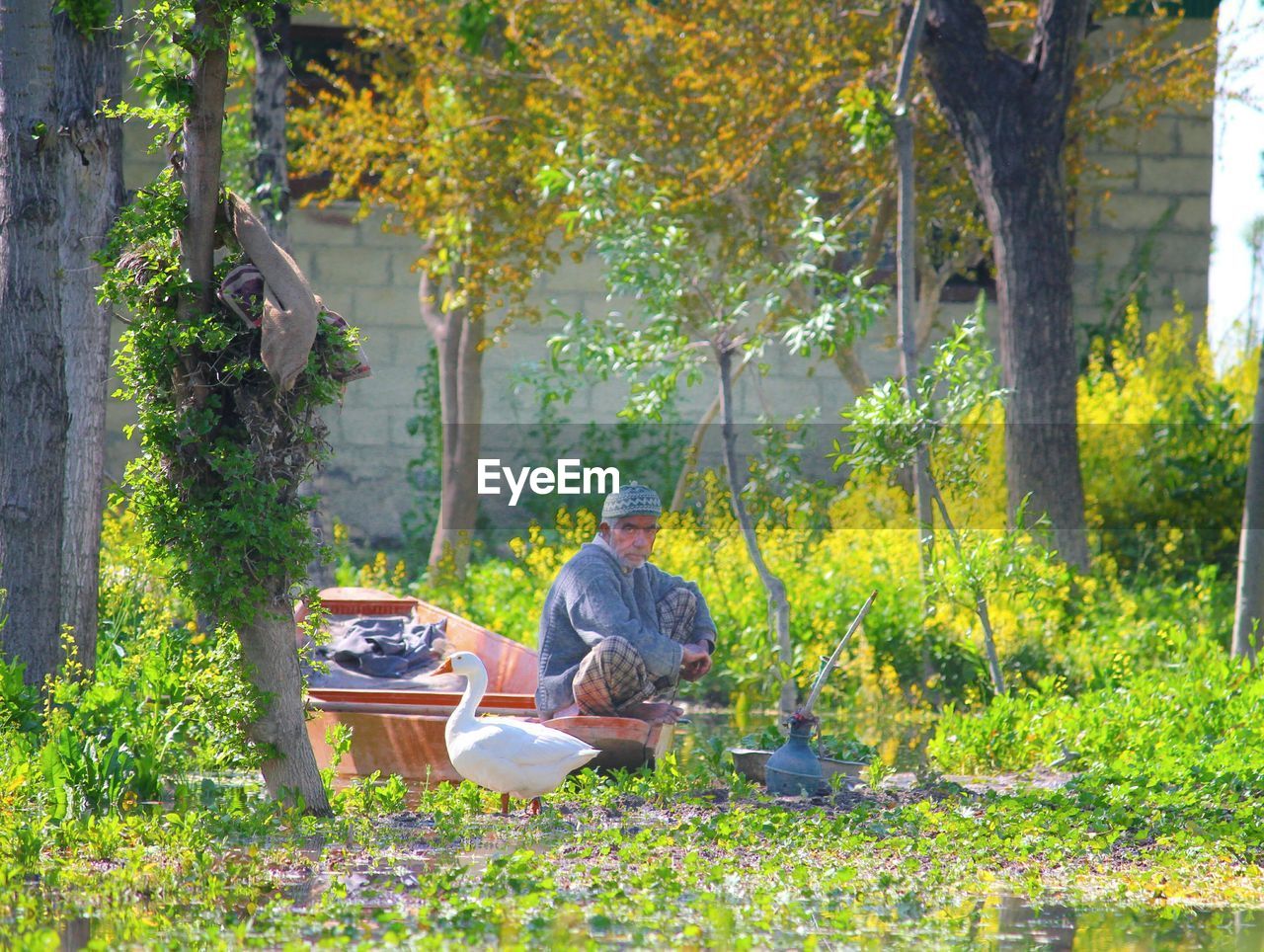 MEN SITTING IN PARK