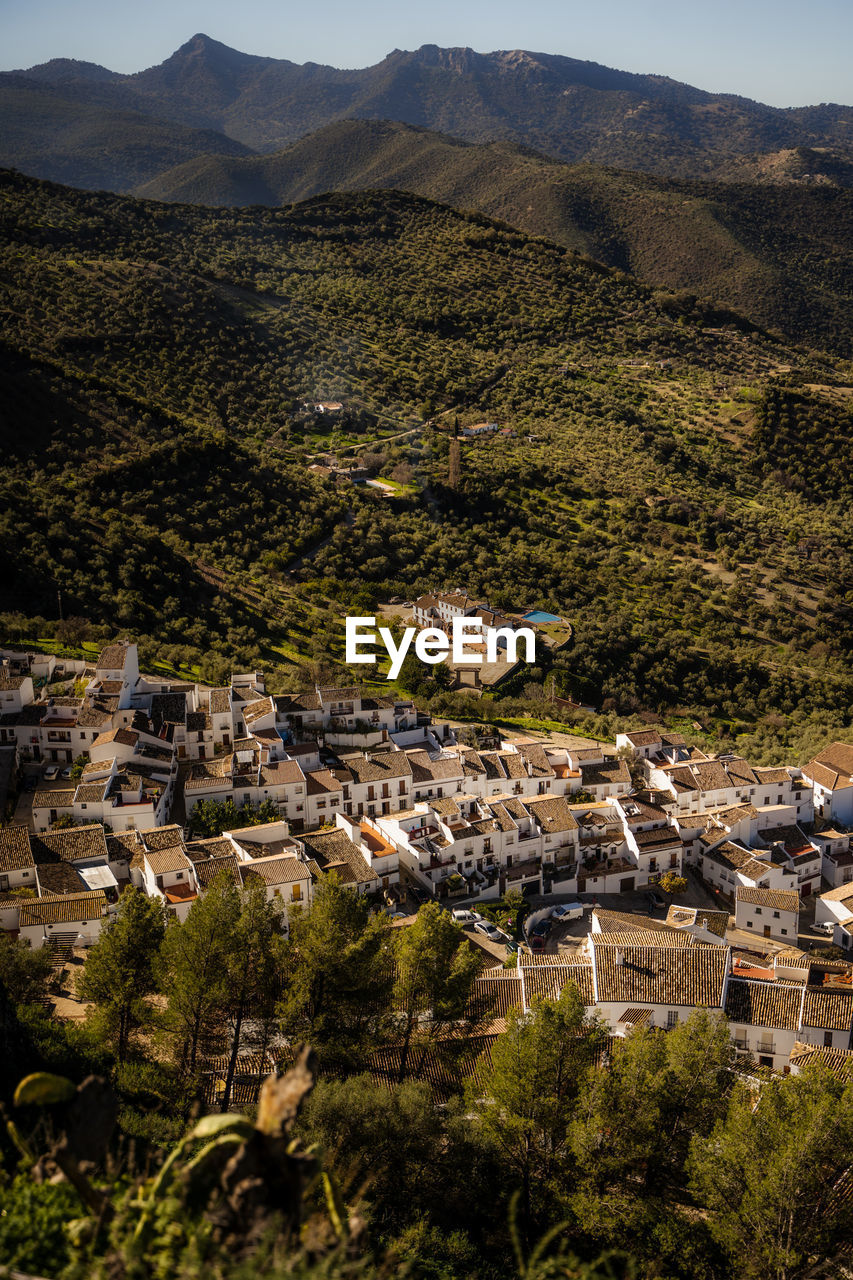 high angle view of townscape against mountains