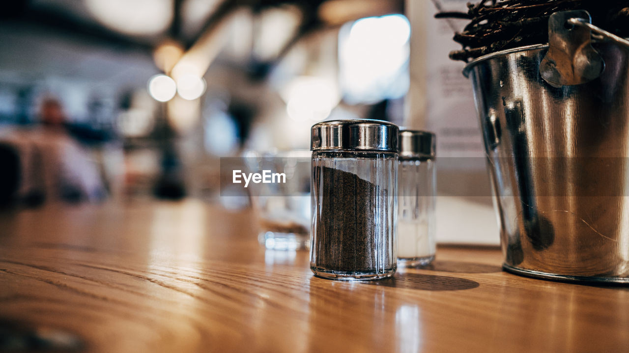 Close-up of salt and pepper on table