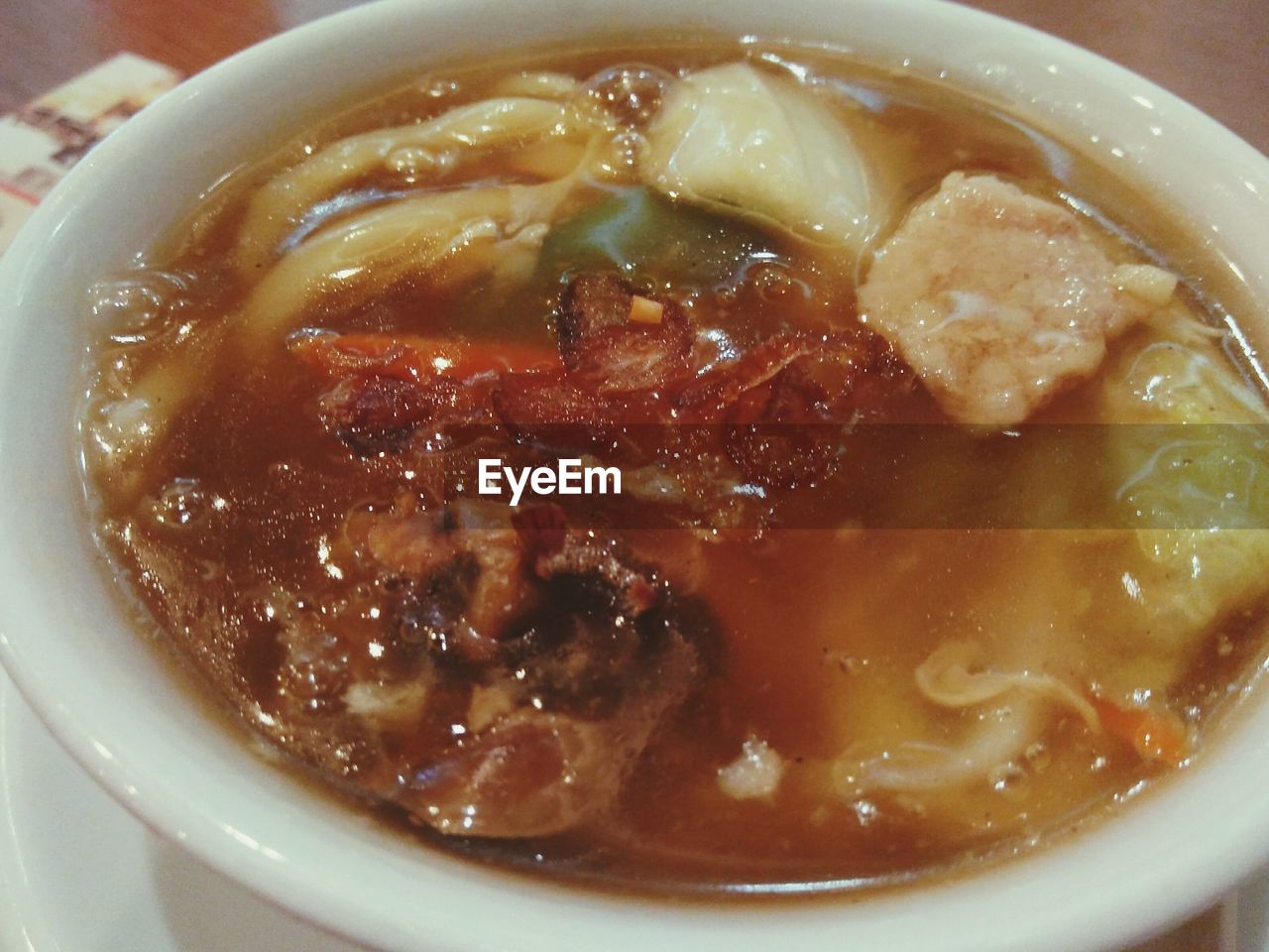 CLOSE-UP OF ICE CREAM IN BOWL WITH SOUP