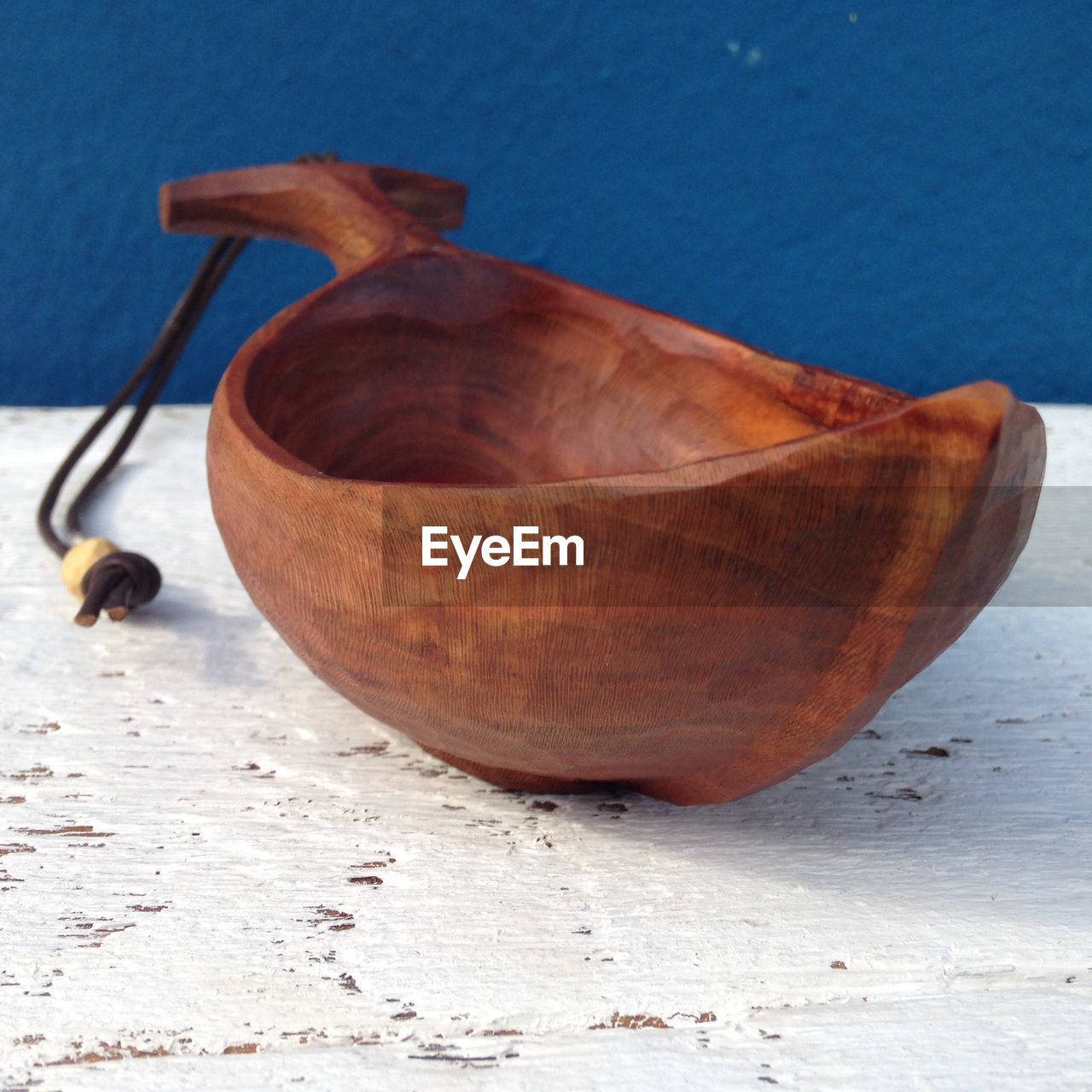 Close-up of wooden bowl on table