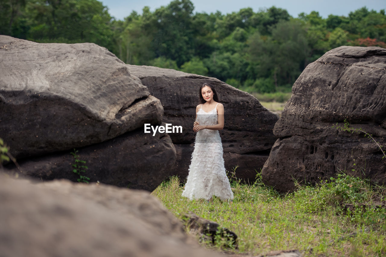 Woman standing on rock