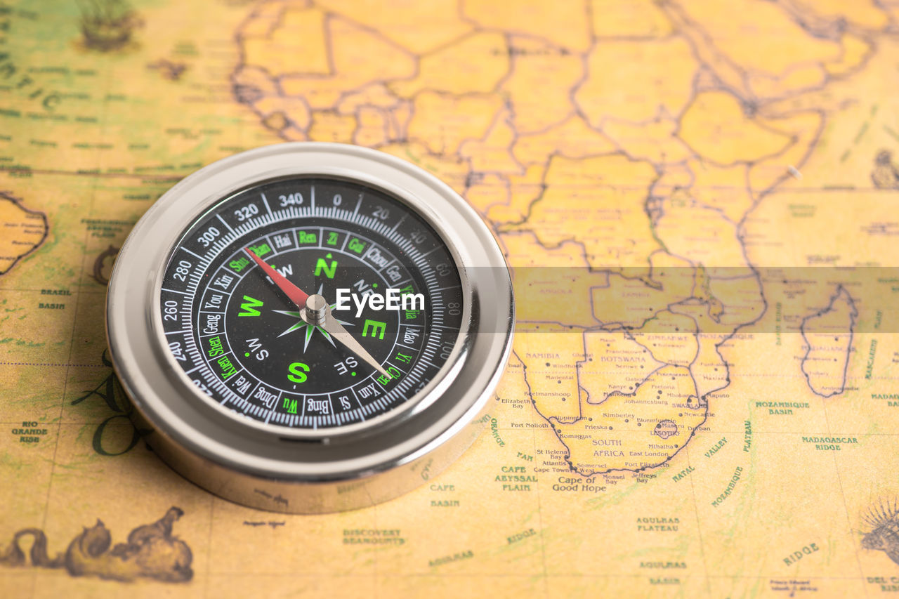 Close-up of navigational compass on table