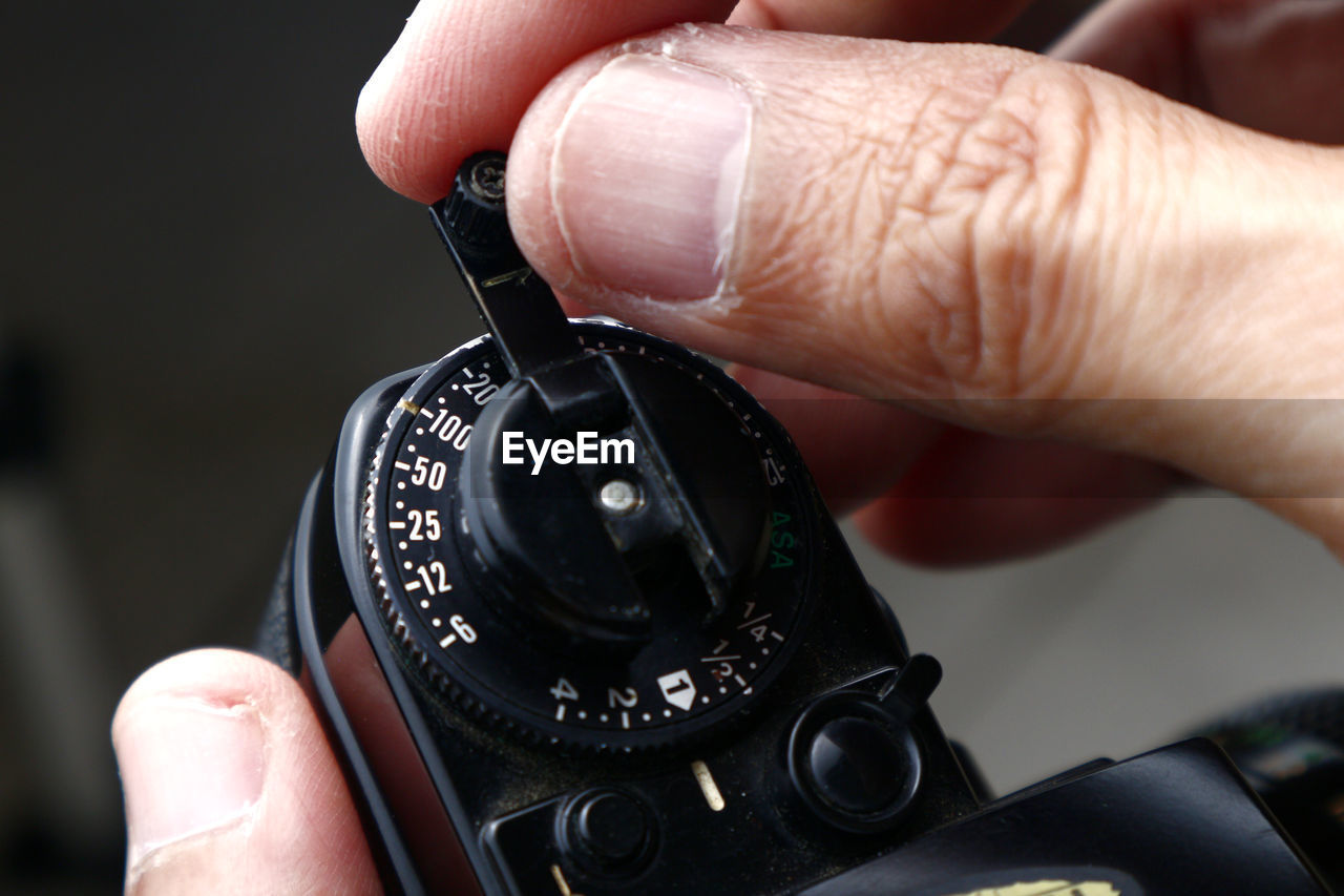 Close-up of person holding camera