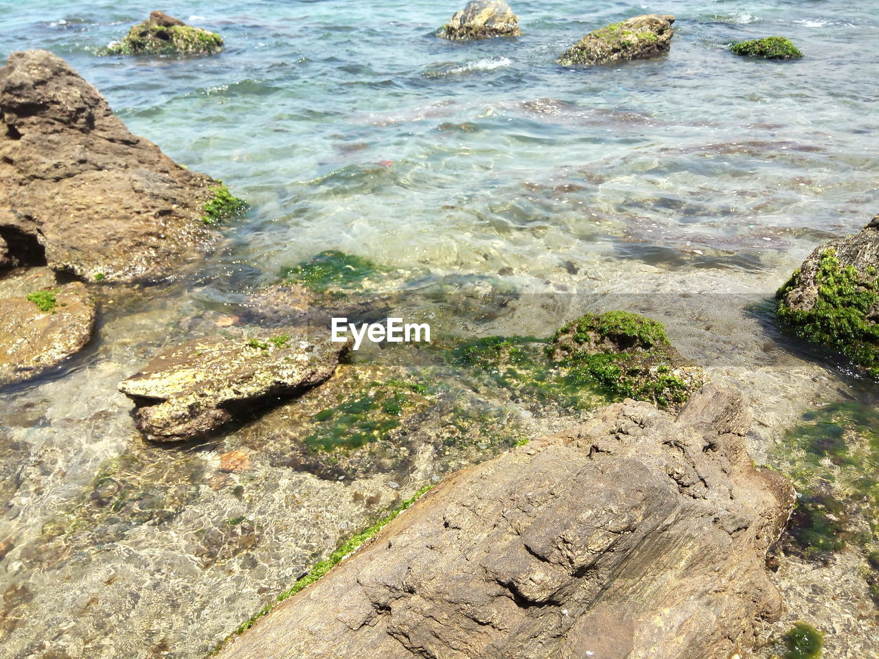 High angle view of rocks in sea