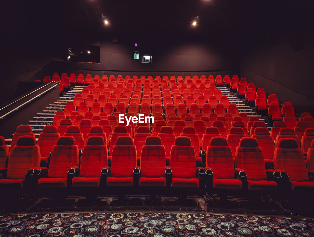 Empty red chairs in a theatre/cinema