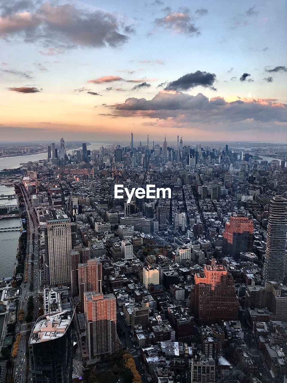 Aerial view at sunset of the island of manhattan looking uptown and the hudson river to the east.