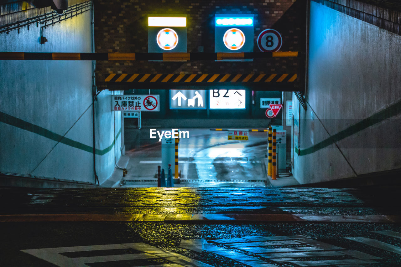 Information sign in illuminated city at night
