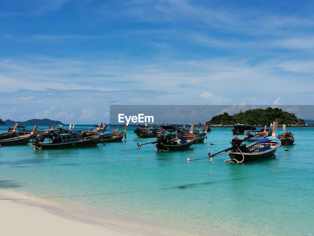 Boats in sea against sky