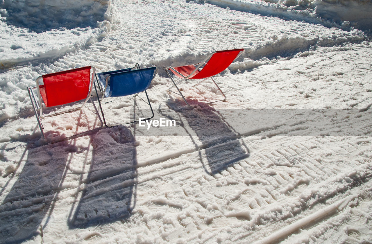 Low angle view of seats on snow