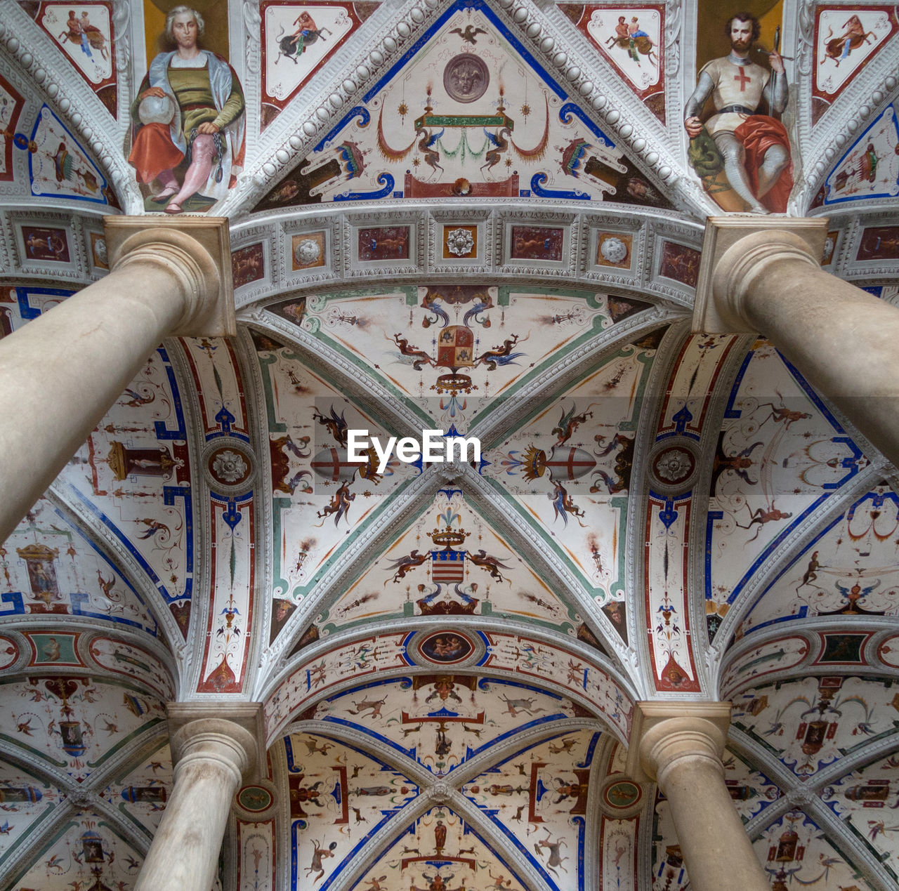 LOW ANGLE VIEW OF A CEILING OF A BUILDING