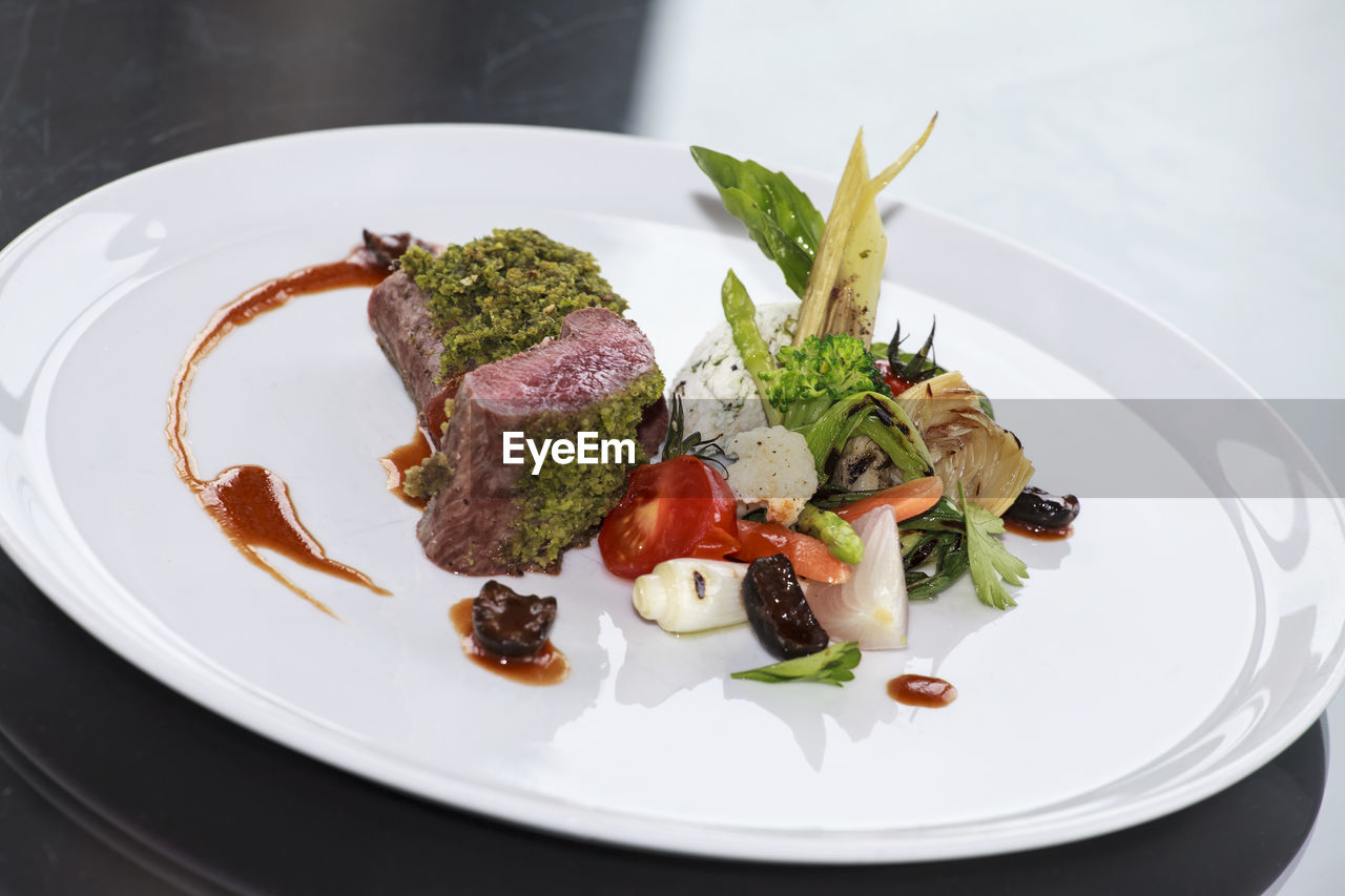 High angle view of fresh food served in plate on table