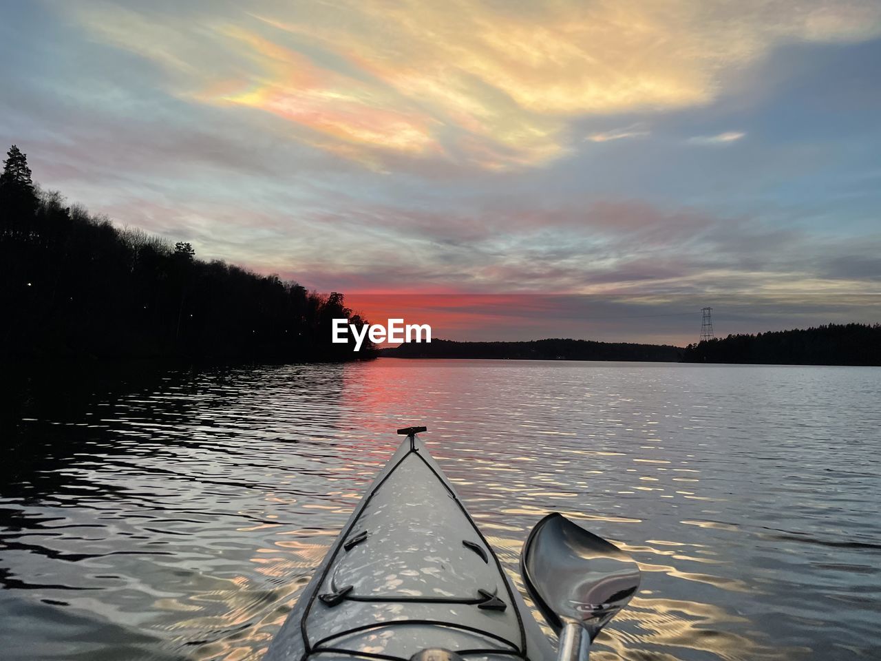 scenic view of lake against cloudy sky during sunset