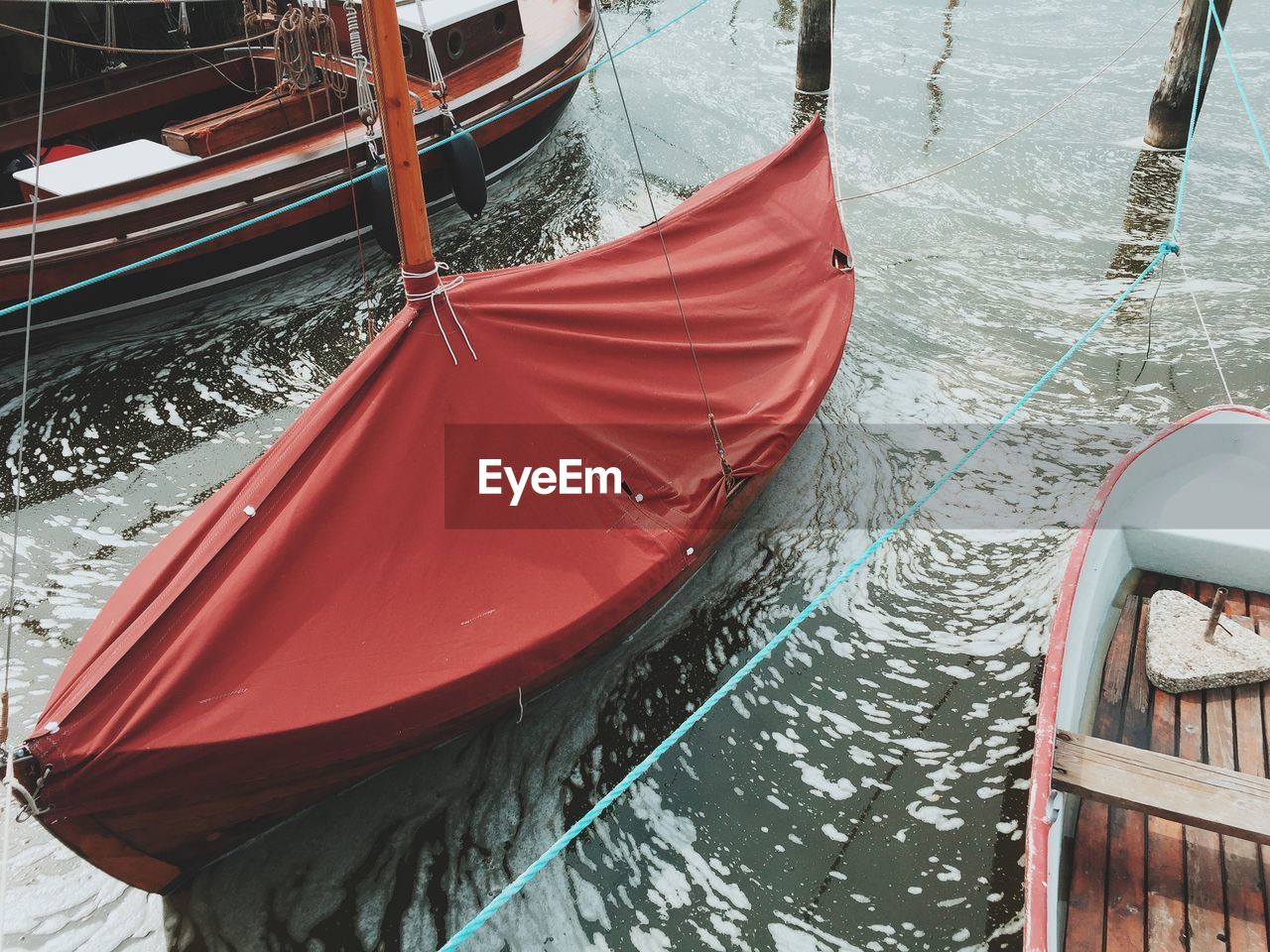 High angle view of boat covered with red fabric