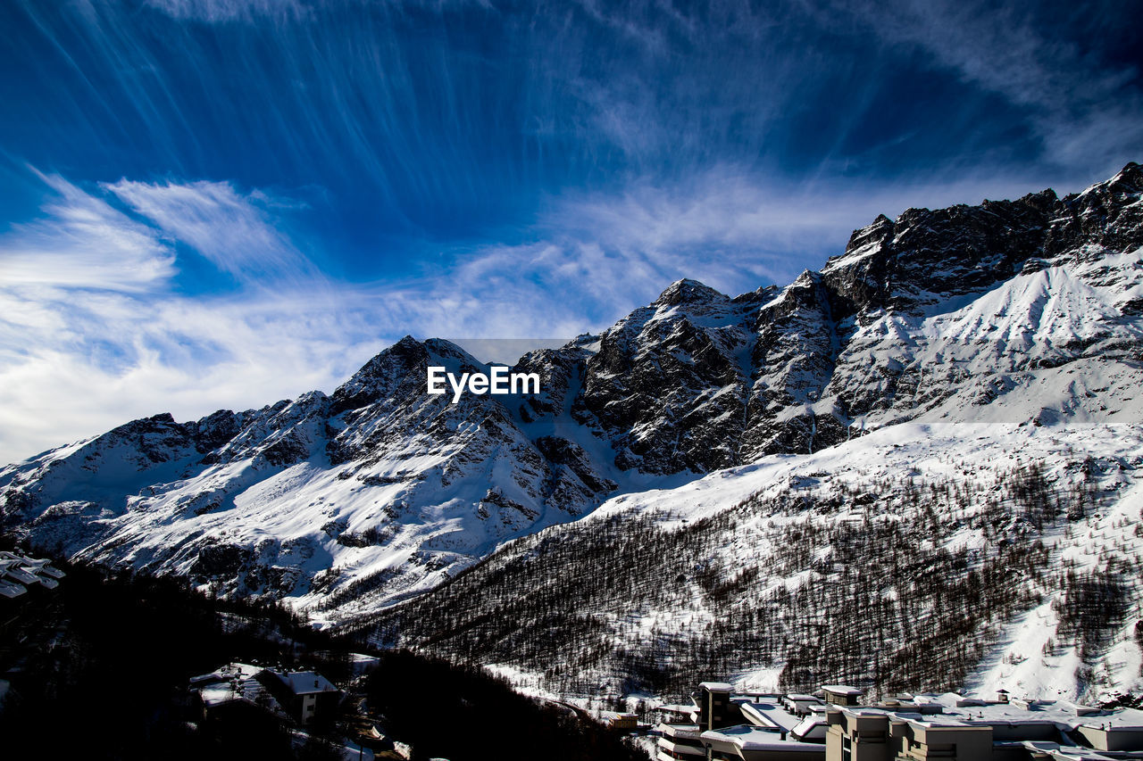 Scenic view of snowcapped mountains against sky