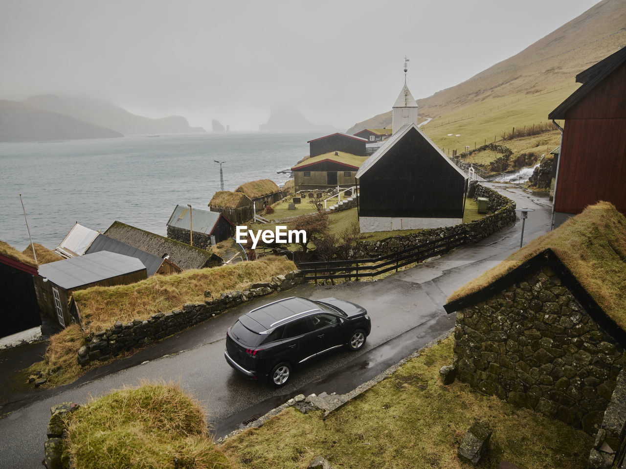 Driving through town of bøur in the faroe islands