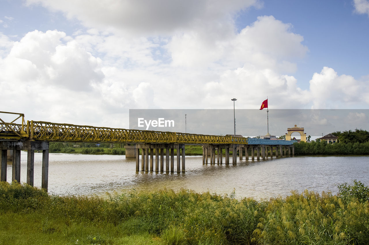 Bridge over river against sky