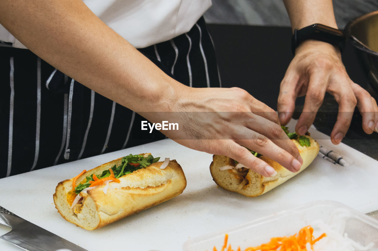 cropped image of man preparing food