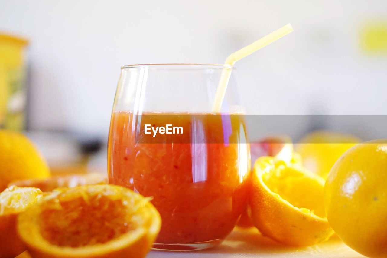 CLOSE-UP OF DRINK WITH JUICE ON TABLE