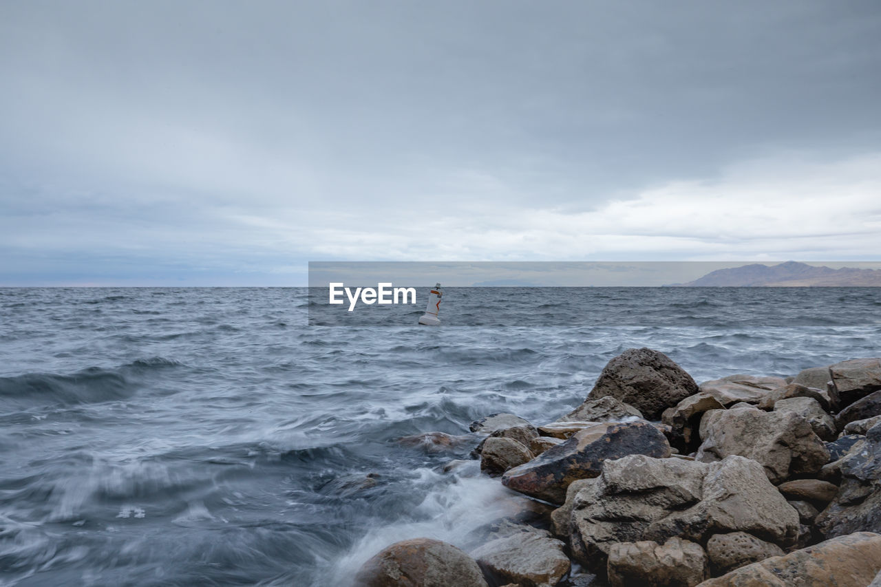 SCENIC VIEW OF SEA AND ROCKS