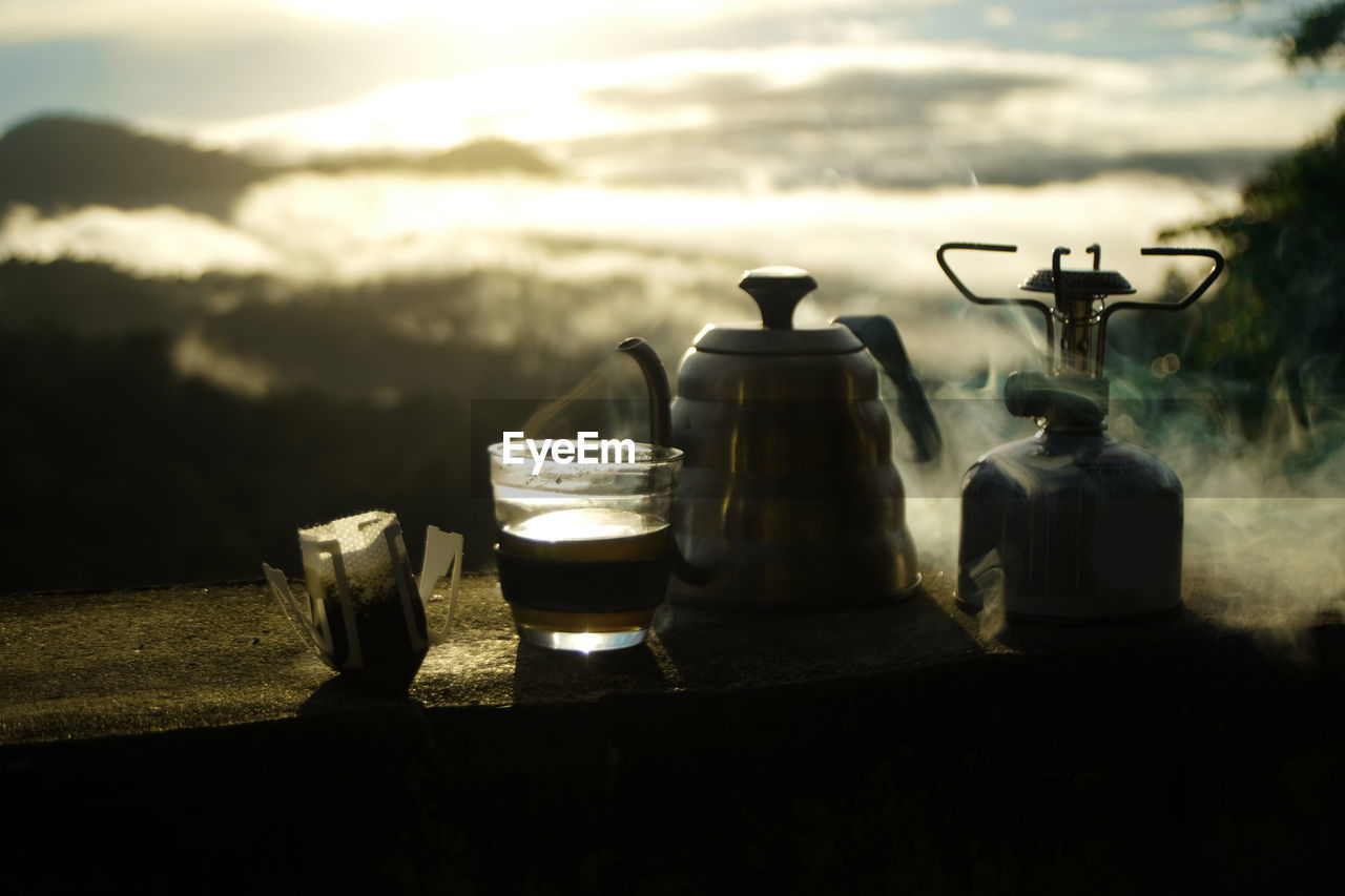 morning, darkness, cloud, kettle, light, food and drink, drink, sky, nature, refreshment, teapot, household equipment, reflection, food, no people, table, night, container, tea, still life photography, black, hot drink, cup, tableware, outdoors, mug, kitchen utensil