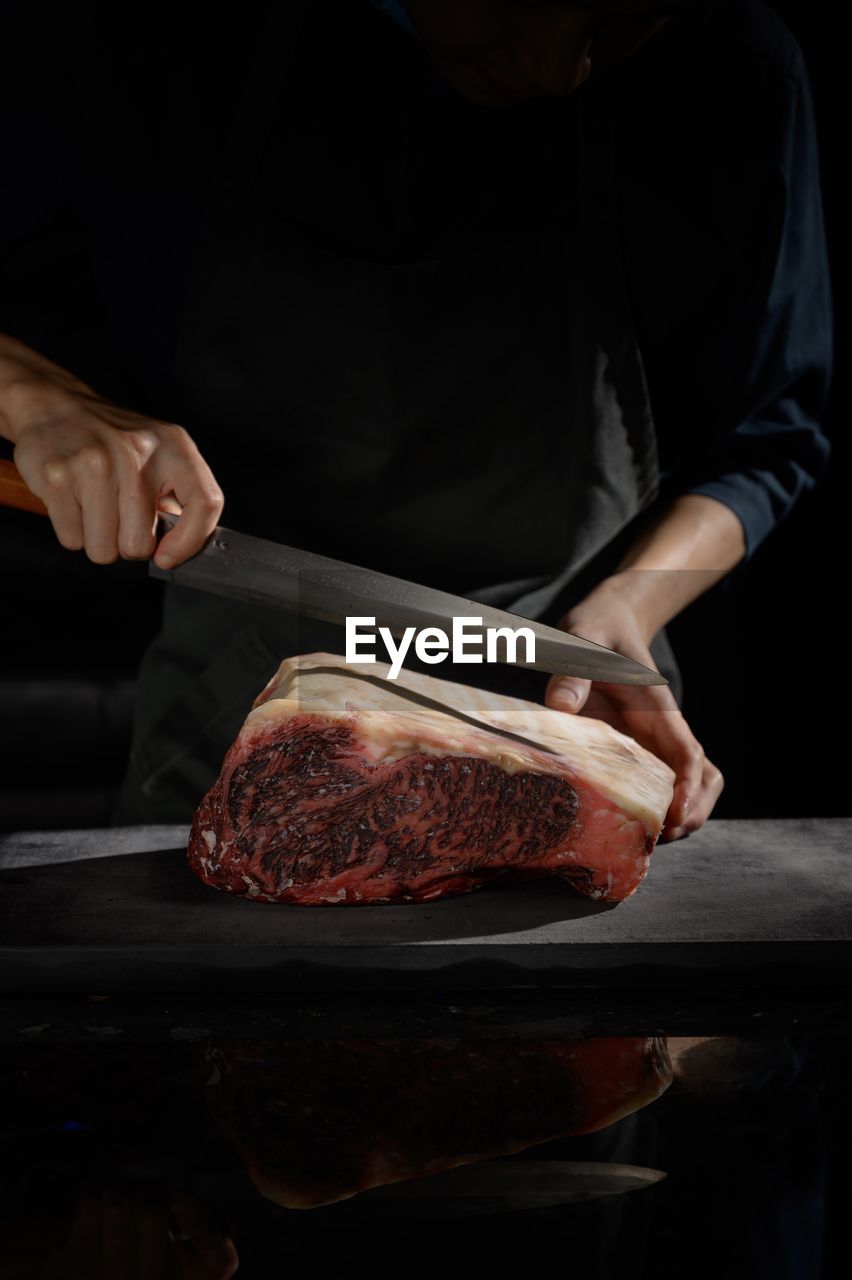 Close-up of man preparing food