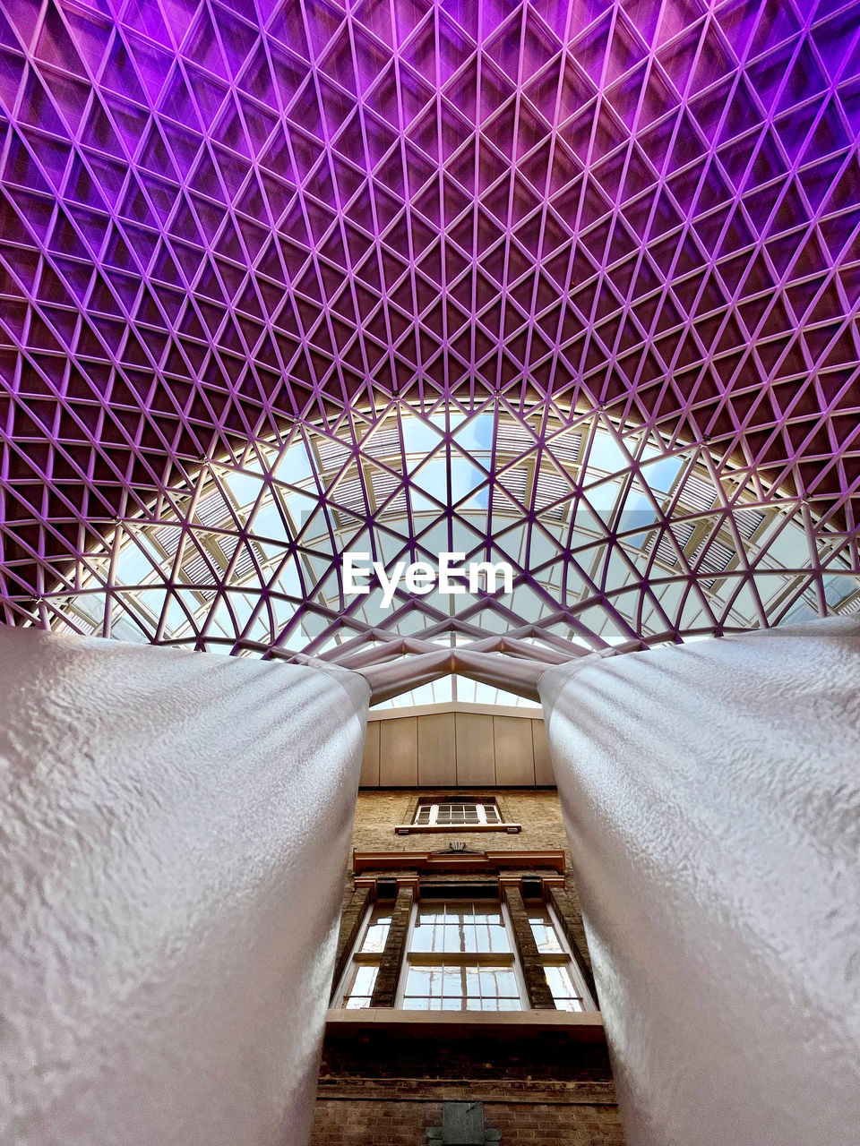 HIGH ANGLE VIEW OF MODERN BUILDING SEEN THROUGH WINDOW