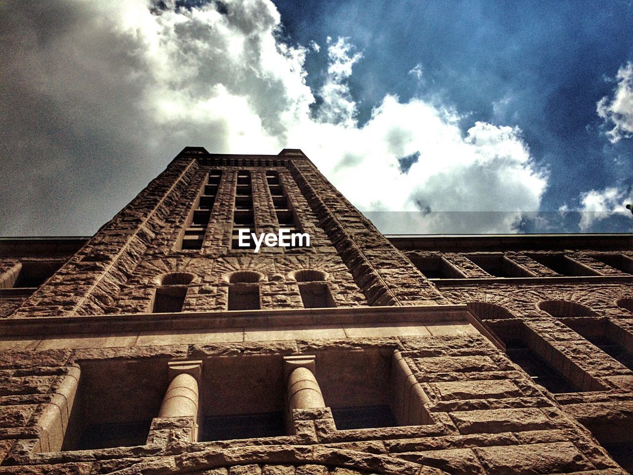 LOW ANGLE VIEW OF TOWER AGAINST CLOUDY SKY