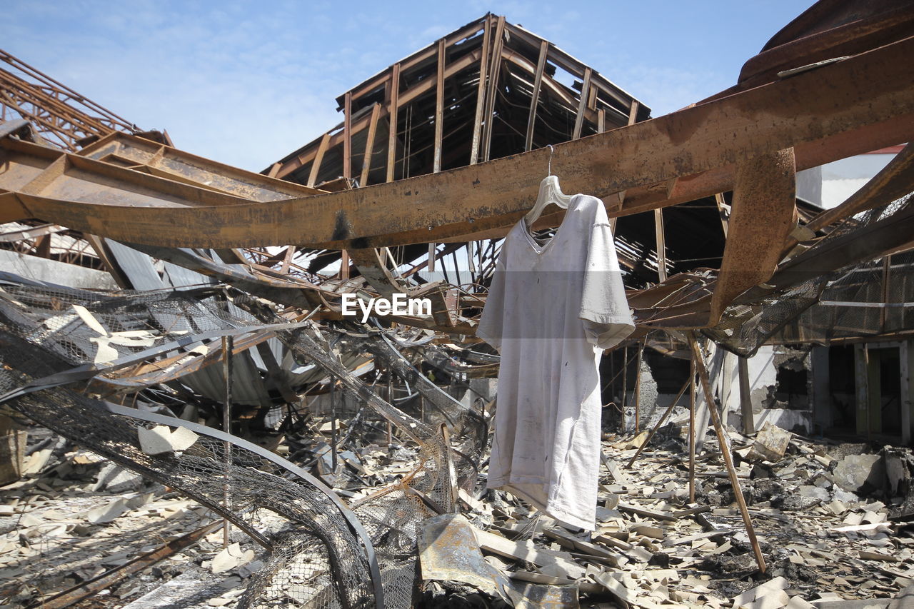 Low angle view of clothes drying on roof against building