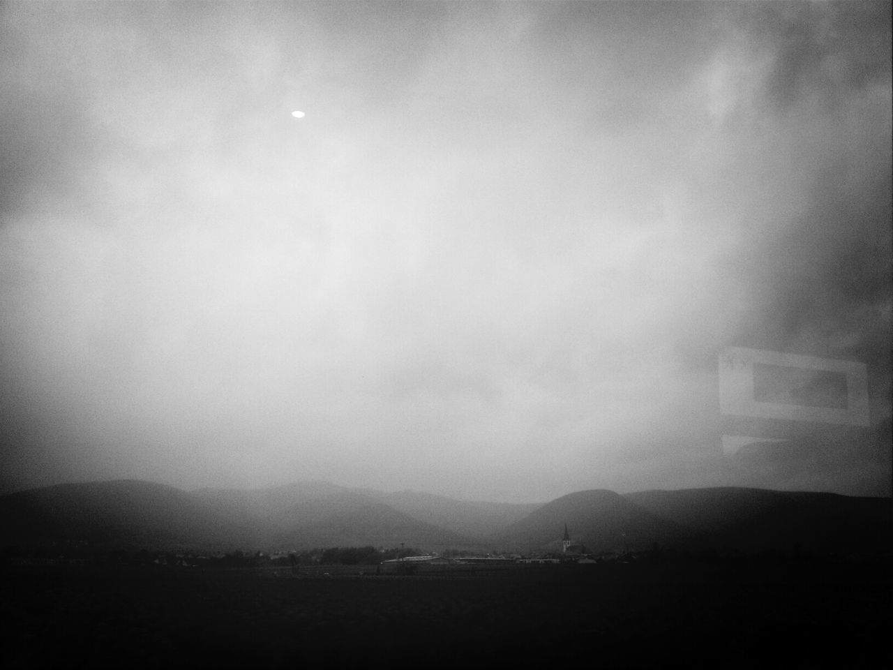 SCENIC VIEW OF MOUNTAINS AGAINST CLOUDY SKY