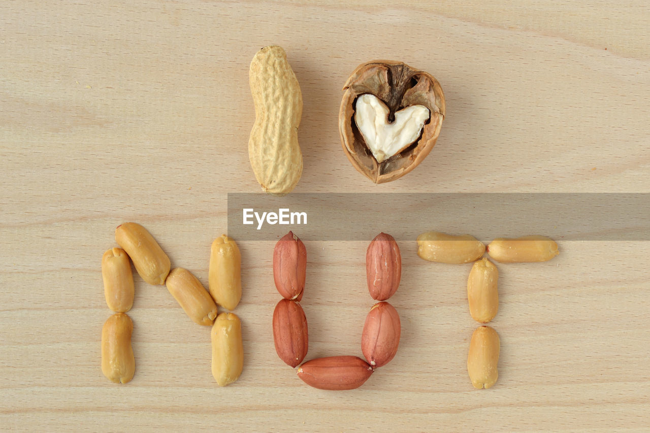 High angle view of walnut and peanut on table