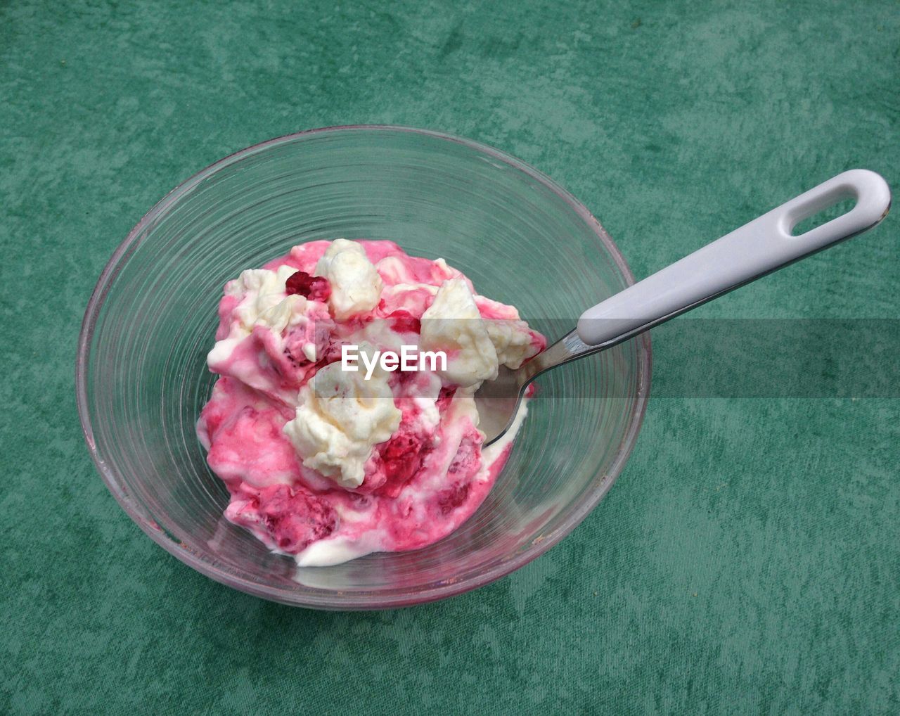 High angle view of raspberry ice cream in bowl on table
