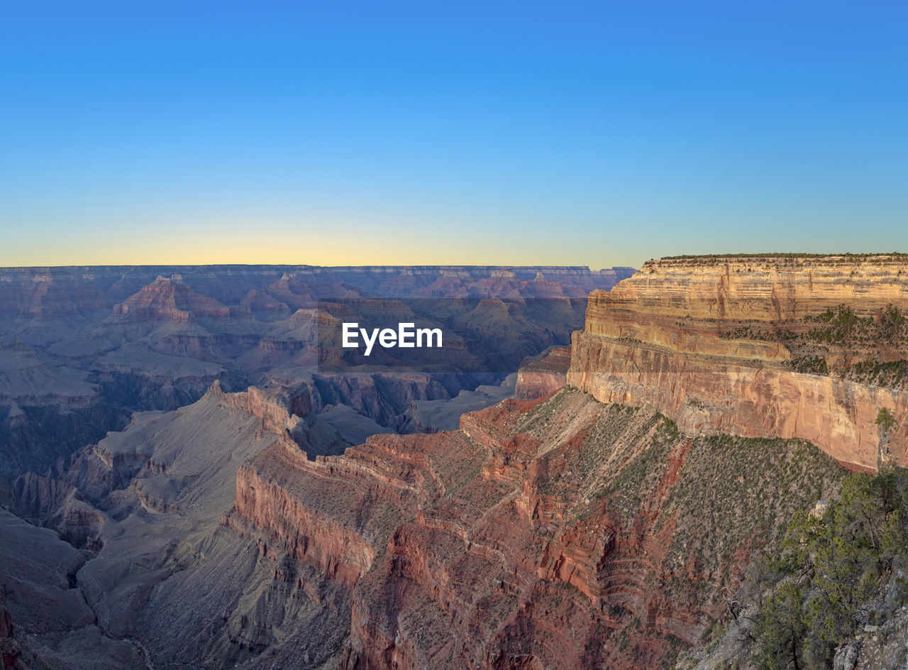 scenic view of mountains against clear blue sky