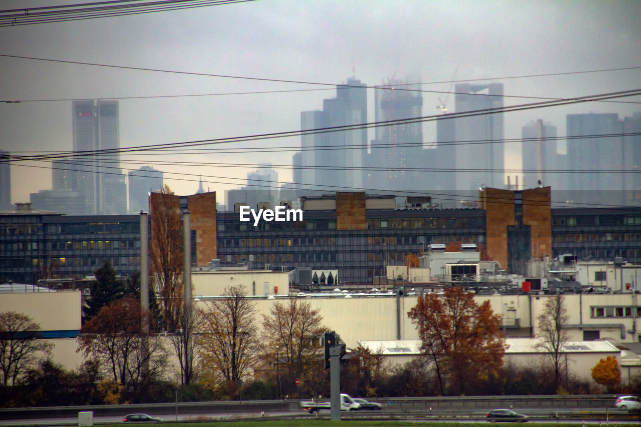 VIEW OF CITY BUILDINGS AGAINST SKY