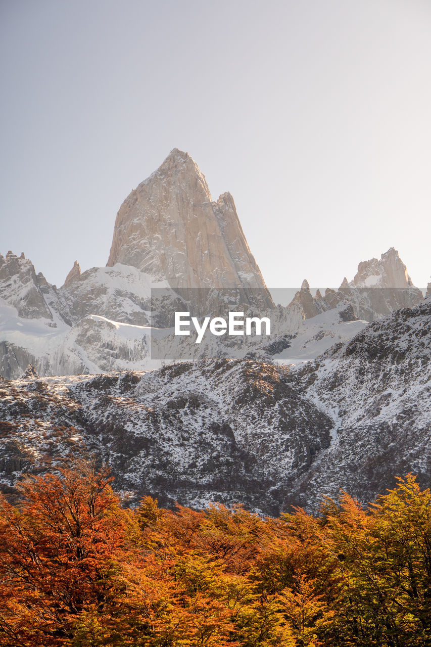 Scenic view of snowcapped mountains against clear sky