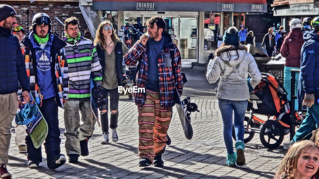 FULL LENGTH OF PEOPLE STANDING AT MARKET