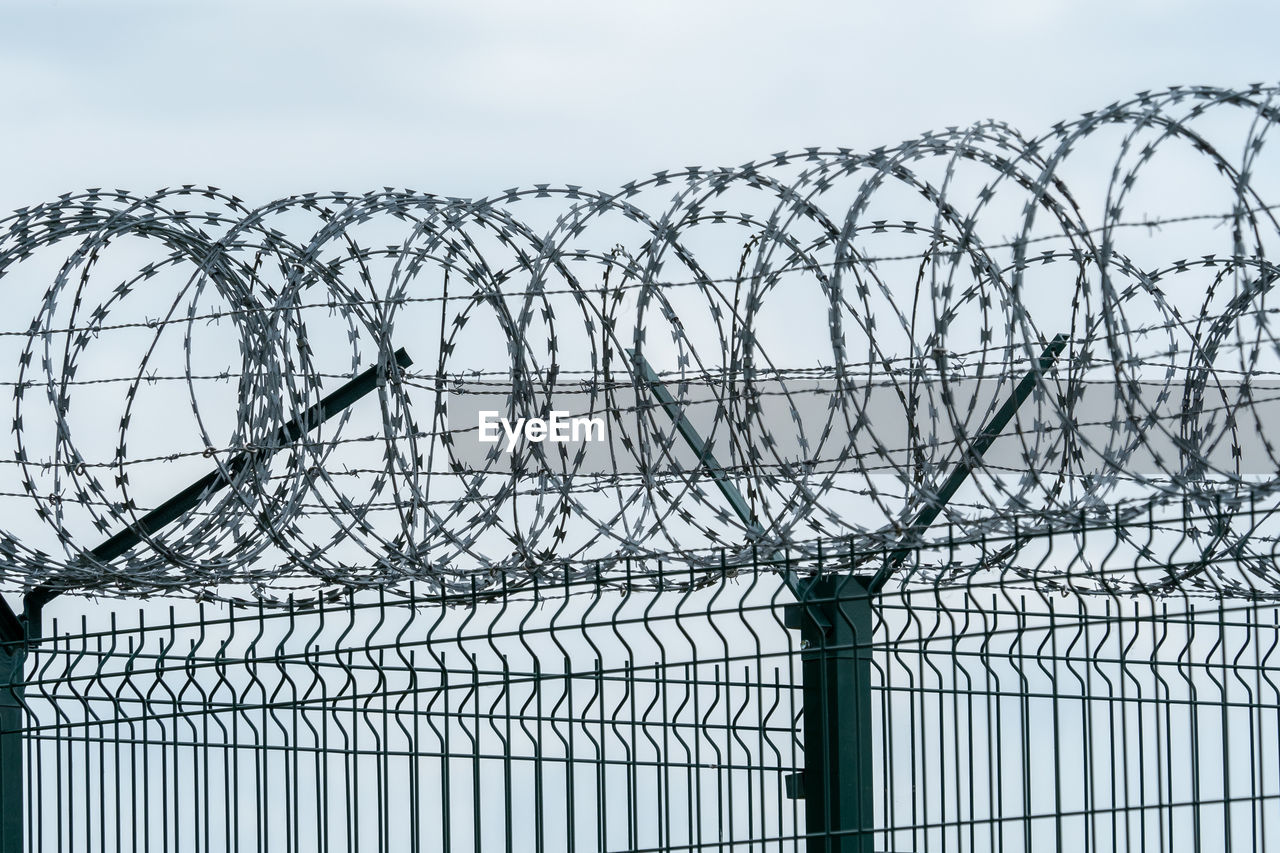 Security fence with a barbed wire. fence with a barbed wire.