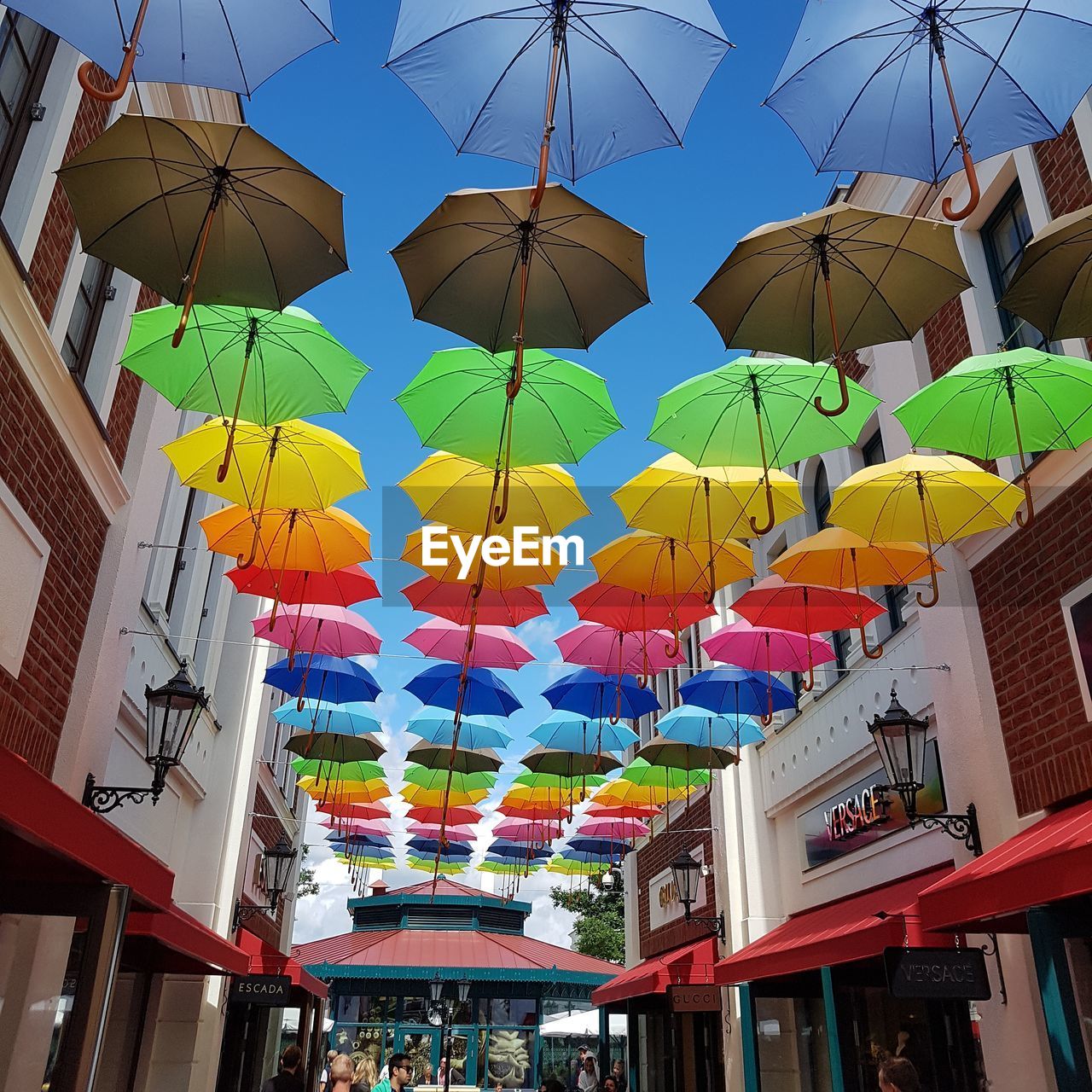 Day Hanging Multi Colored Low Angle View Celebration Lantern Outdoors No People Architecture Umbrella Umbrellas In The Sky Umbrellas Regenschirme Shopping ♡ Blue Sky Blue Sky Sky And Colors Clear Sky