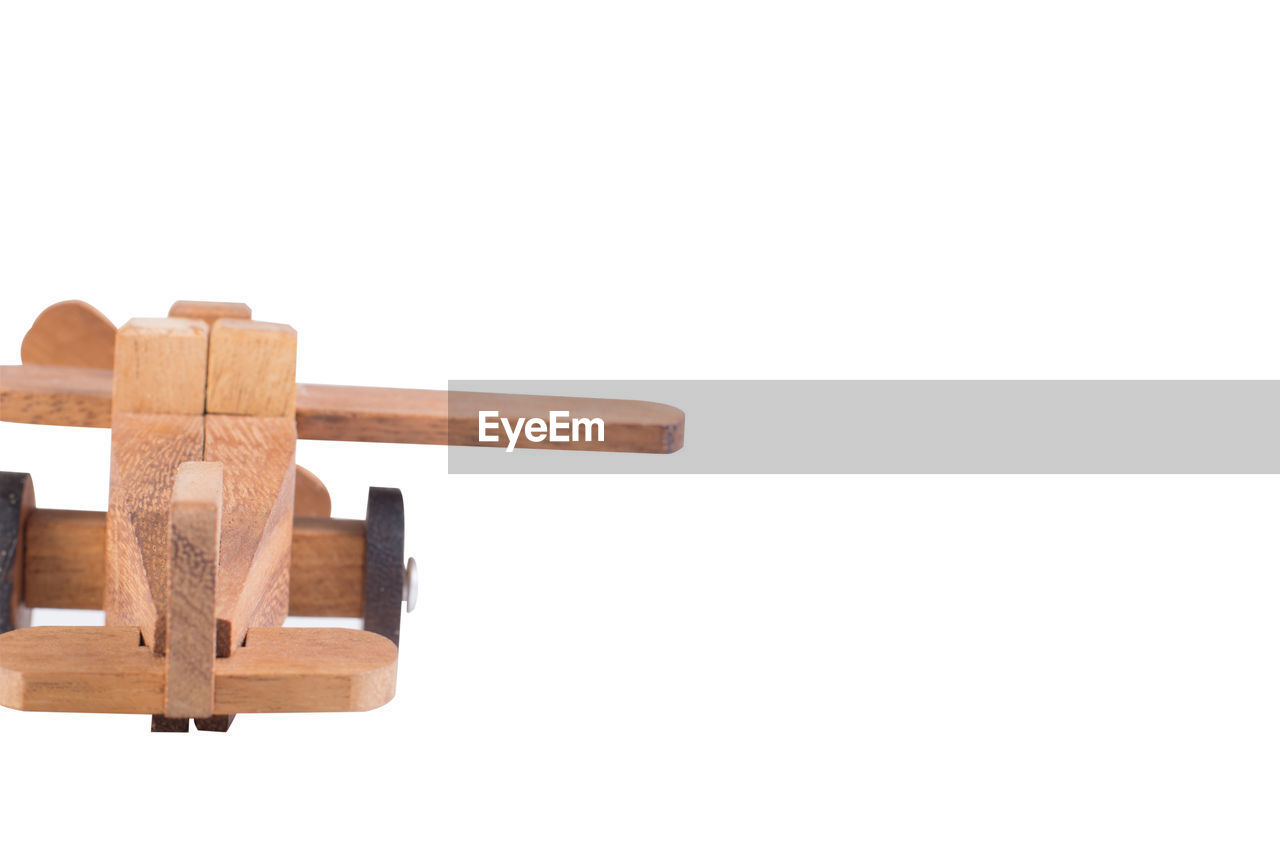 CLOSE-UP OF TOY OVER WHITE BACKGROUND