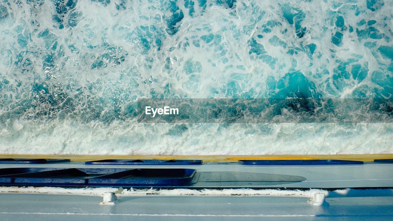 Cropped image of boat sailing in sea