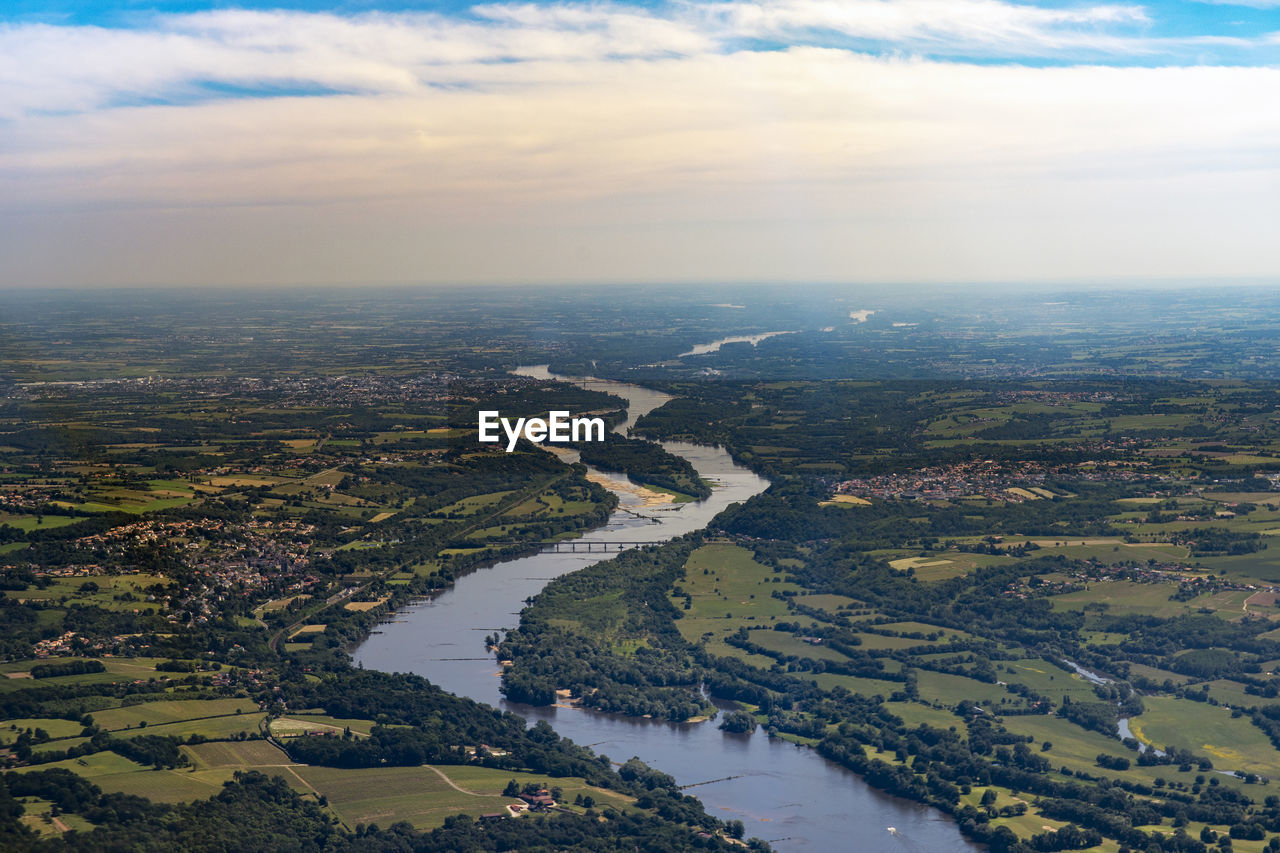 AERIAL VIEW OF RIVER AMIDST LANDSCAPE