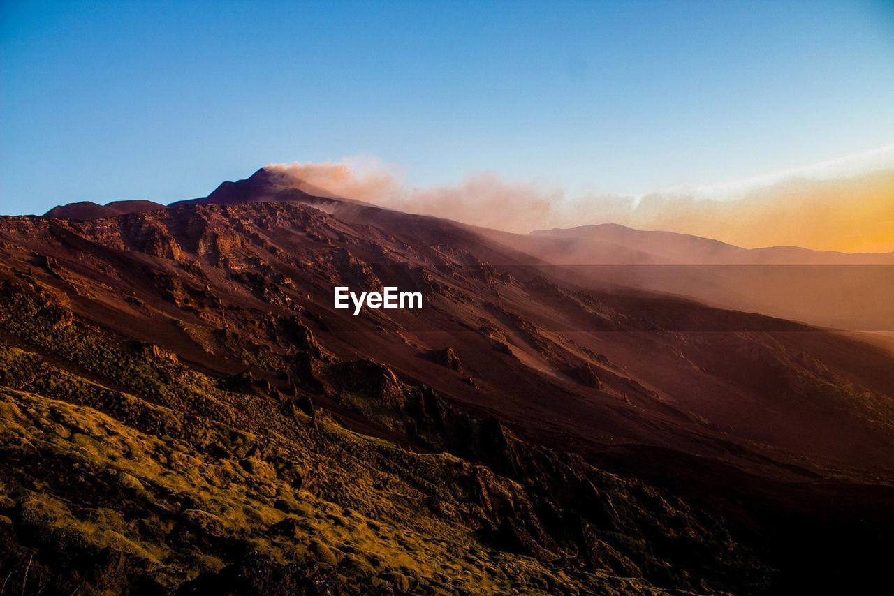 Etna in the suggestive panorama at dawn in the valle del bove - sicily
